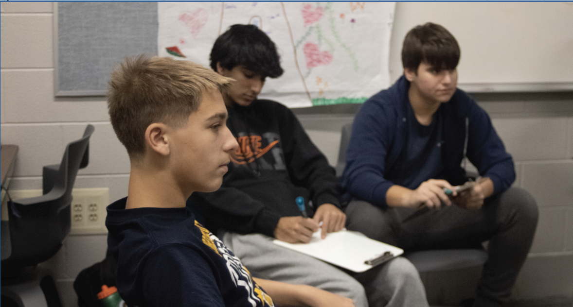 PEERING IN:  Left to right- Peer group members and freshmen Lewk Schiestel (top left), Kayaan Thakkar (top middle), Matthew Malek (top right) sit together and discuss during their meeting. 